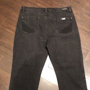 SIMON Chang black denim jeans.